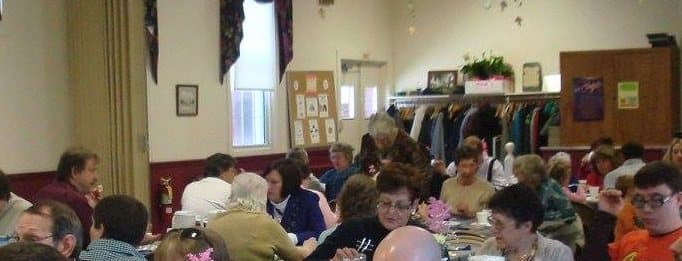 The congregation sharing a meal in the Fellowship Hall